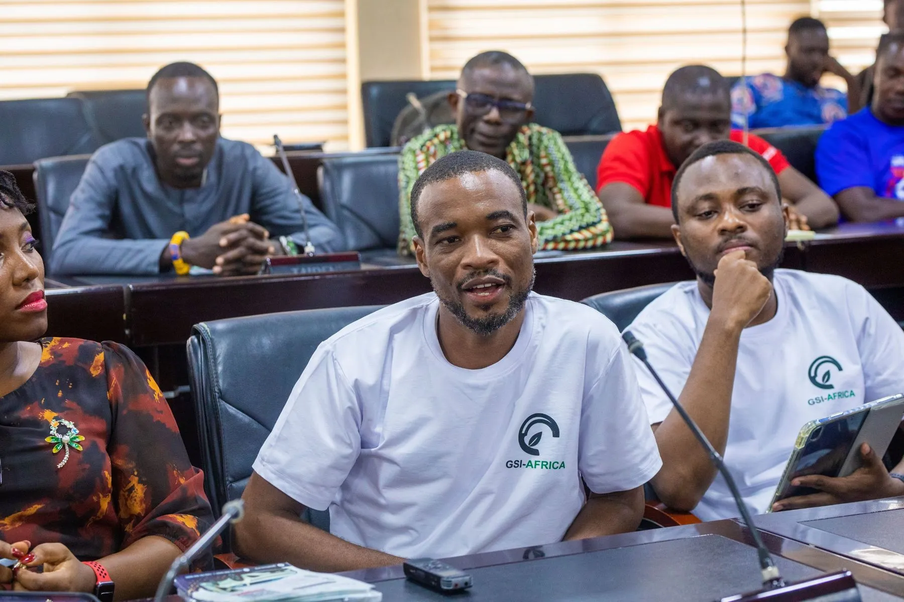 GSI team members in white branded shirts at the launch meeting with UEW staff