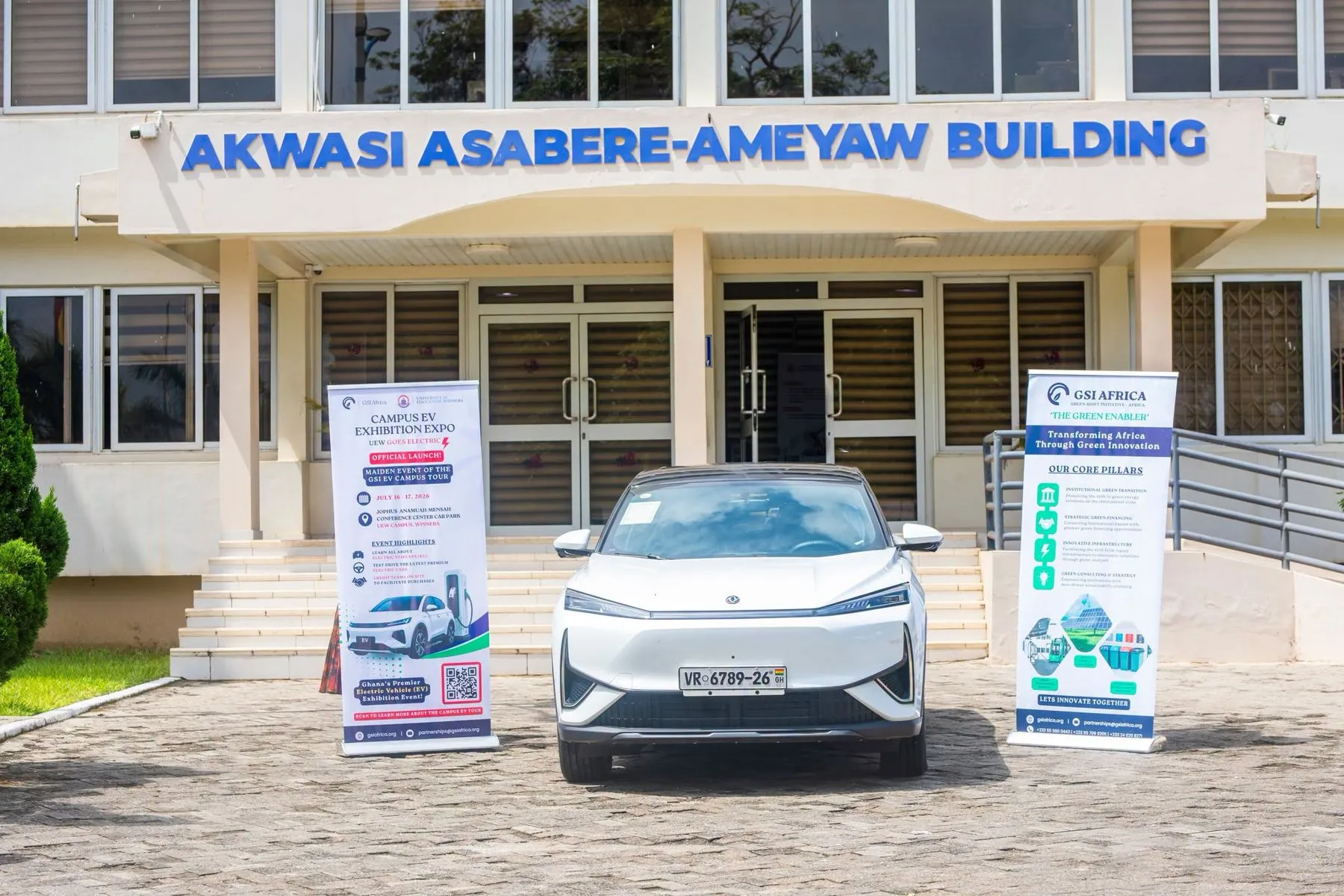 An electric SUV parked outside the Akwasi Asabere-Ameyaw building at the University of Education, Winneba, between two GSI Africa banners